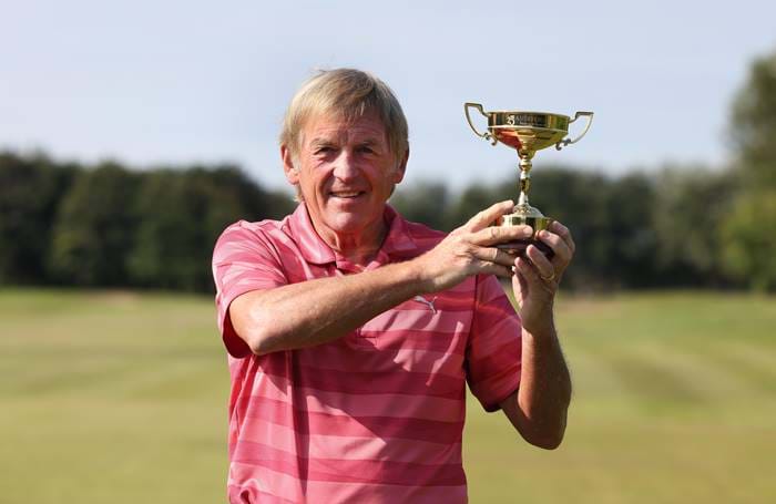 Man holding a golfing trophy